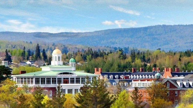 StFX campus, showing the mountains in the background and surrounded with trees 