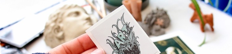 Person holding sticker