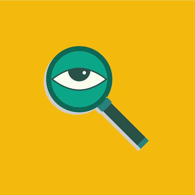 Magnifying glass with an eyeball in the centre, and a mustard yellow background