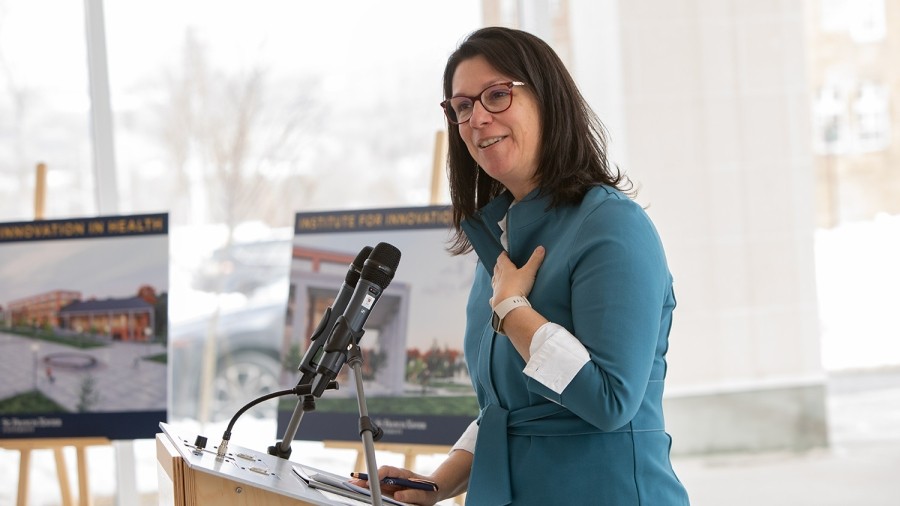 Provincial cabinet minister Michelle Thompson at a podium
