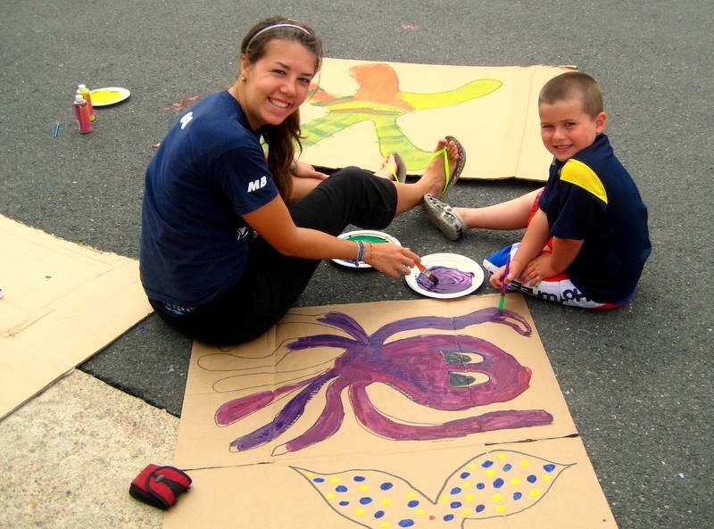 Picture of a Student Painting an Octopus with a Child