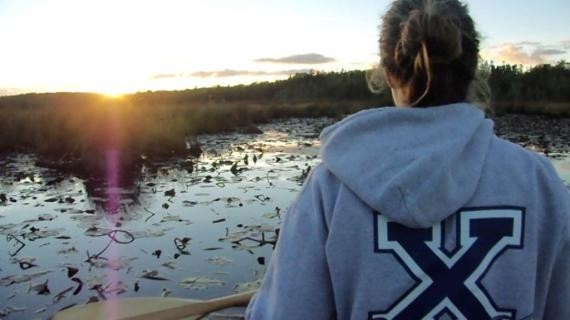 Picture of Student on a Canoe while in a River