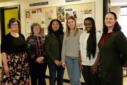 A group of women standing next to each other
