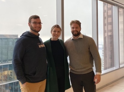 Three KPMG employees standing for a picture
